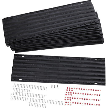 Set of black rubber mats with additional components on a white background