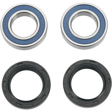 Two blue wheel bearings and two black wheel seals for a motorcycle, displayed on a white background.