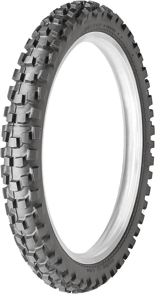 Motorcycle tire with knobby tread pattern on a white background