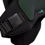 Close-up of a black and green protective vest with a brand label on a white background