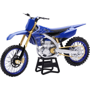Yamaha YZ450F Blue dirt bike model on a stand against a white background 
