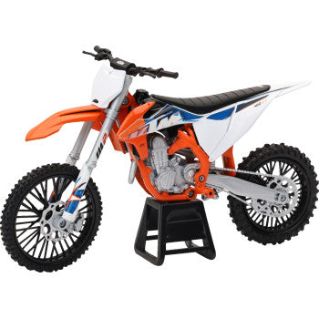 KTM 450 SX-F Dirt Bike
Model dirt bike on a stand with an orange, white, and blue color scheme.