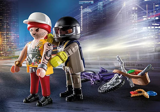 Two toy figures in a cityscape setting with a motorcycle and urban elements.