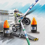 Playmobil toy set with a motorcycle and rider on a snowy track