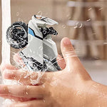 Hand holding a transparent bottle with a black and white lid, filled with water droplets.