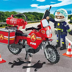 Playmobil fire motorcycle with firefighter figure on a road with traffic cones.