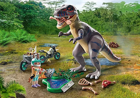 Toy dinosaur and figures in a jungle setting with trees and grass.