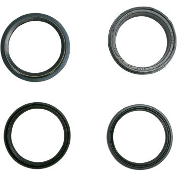 Four black rubber oil seals on a white background