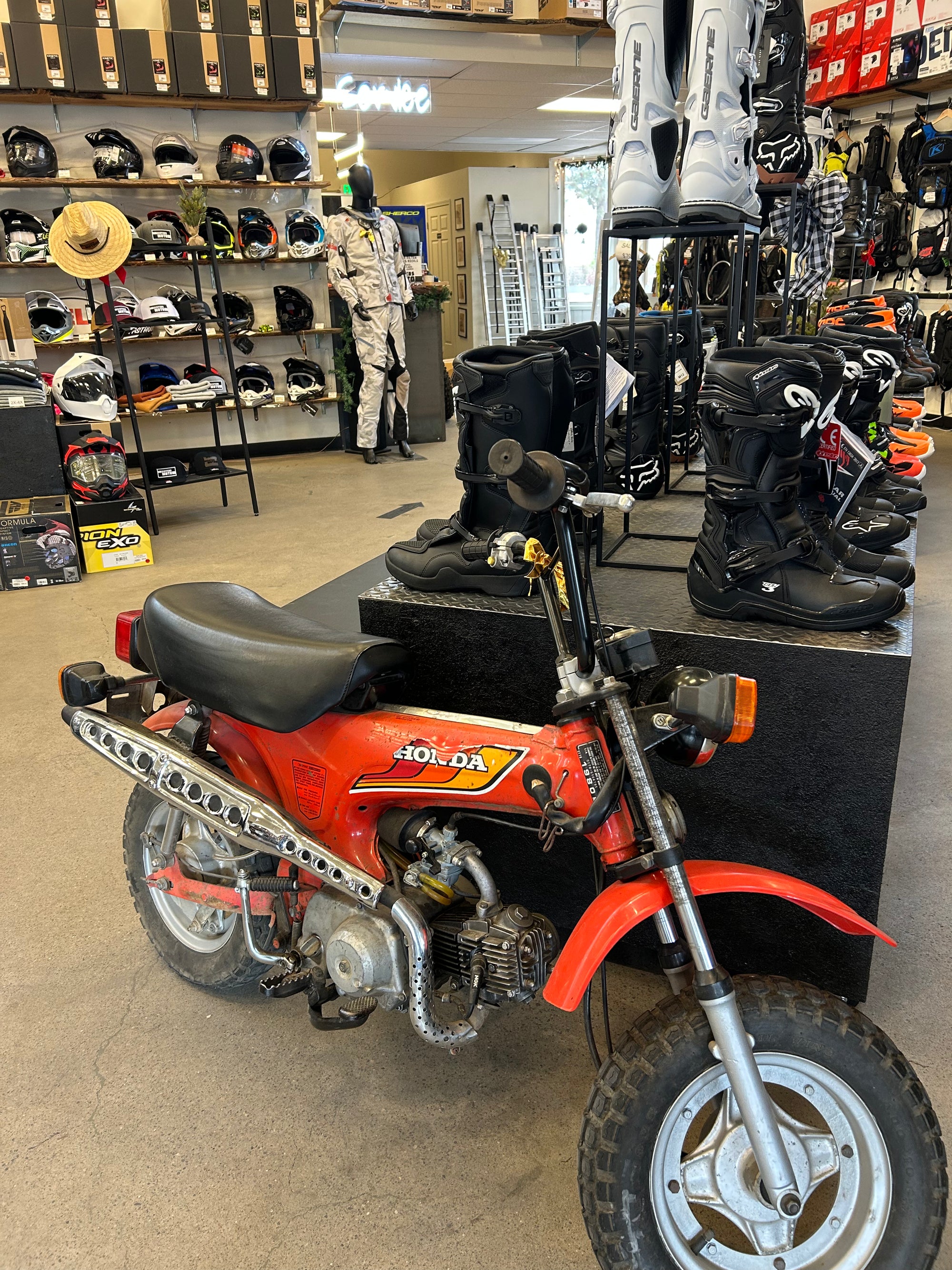 Dirt bike on the floor of the Sisters Moto shop
