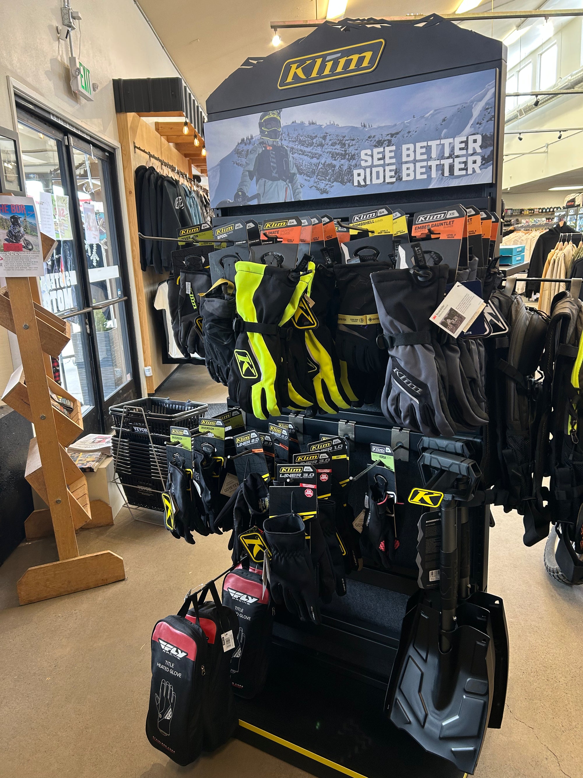 Motorcycle parts and accessories on the shelves at Sisters Moto