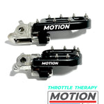 Two throttle foot pegs with 'MOTION' branding on a white background.