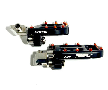 Pair of motorcycle foot pegs with 'Motion' and 'ADV' branding on a white background