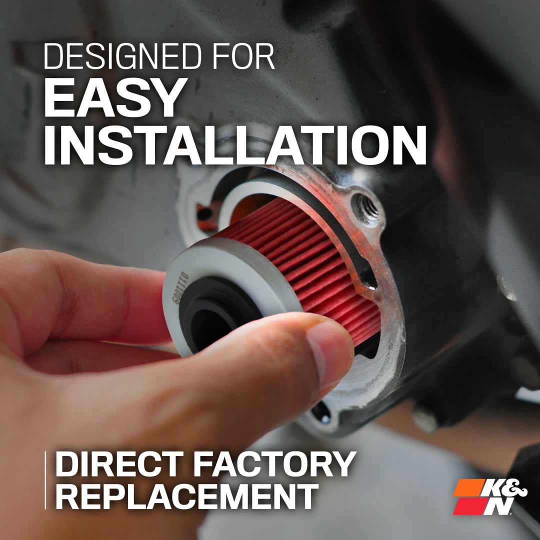 Hand holding a red K&N air filter with text about easy installation and direct factory replacement.