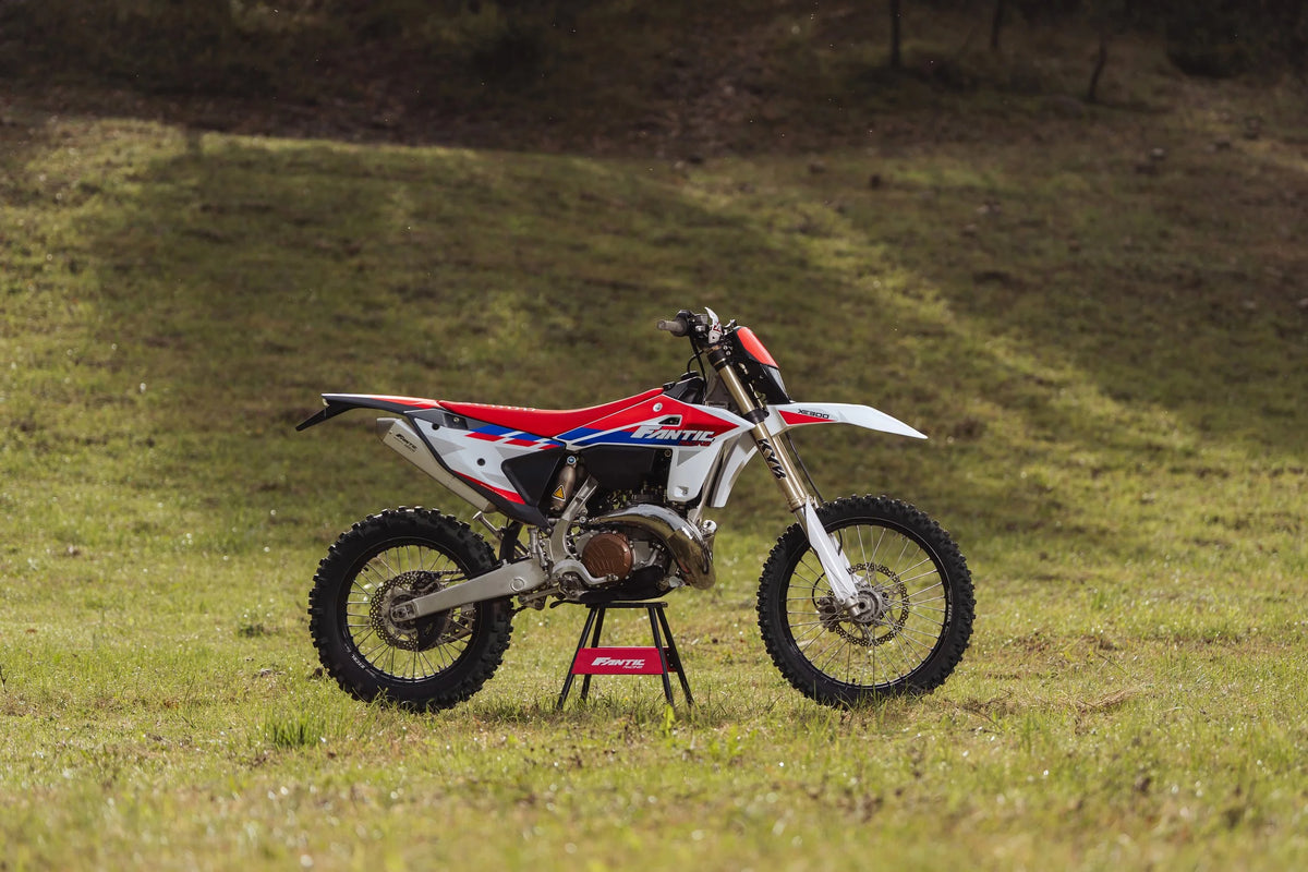 2027 Fantic XE300 2T on a stand in a grass field