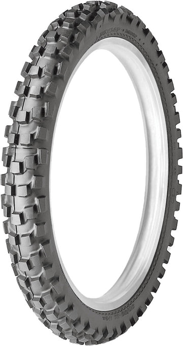 Motorcycle tire with knobby tread pattern on a white background
